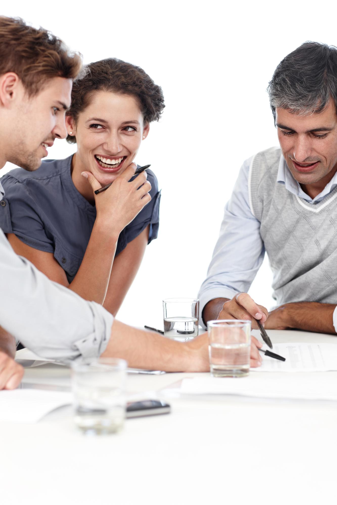 Small team discussing budget sheets
